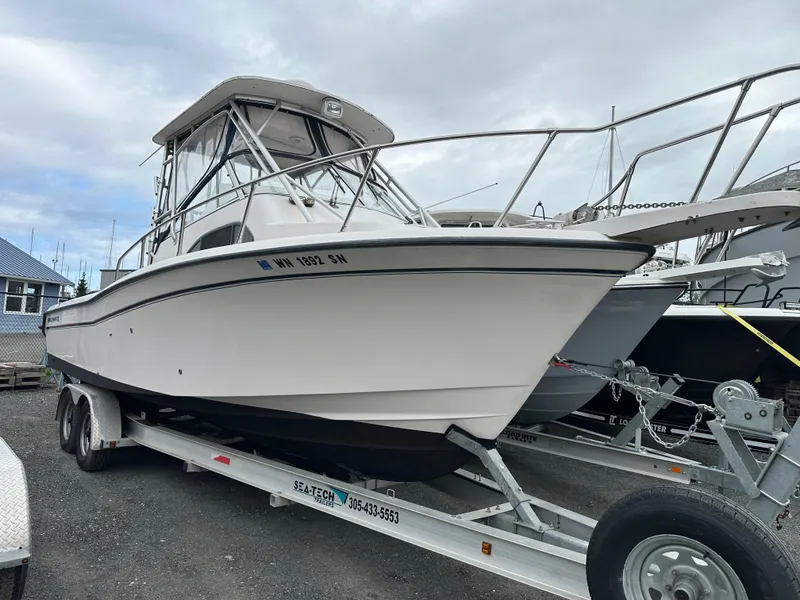 Slide: The Image of 2001 Grady-White Sailfish 282 boat on trailer, parked outdoors. - 0