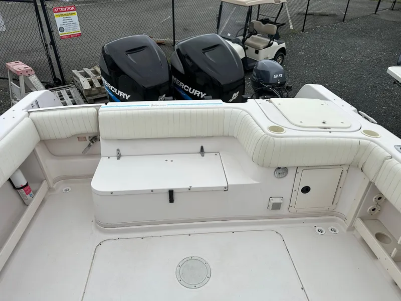 Slide: The Image of 2001 Grady-White Sailfish 282 boat deck with Mercury outboard engines. - 11