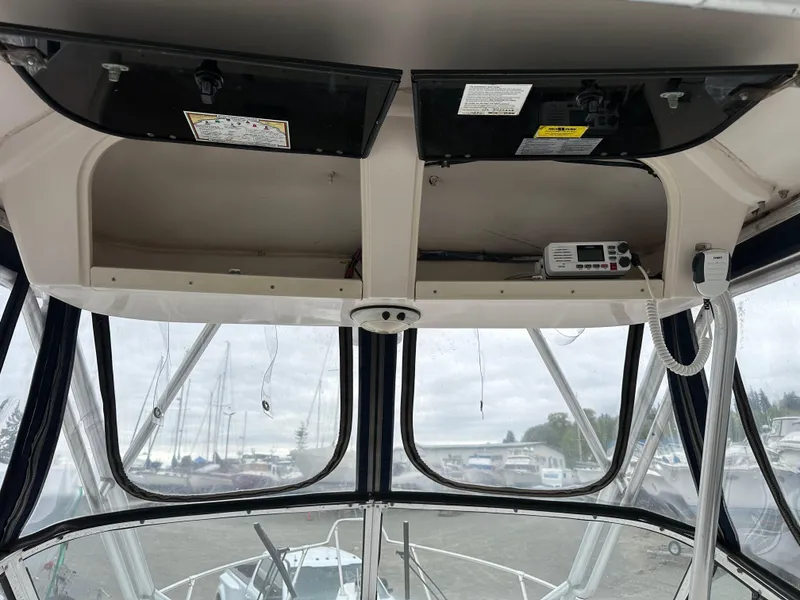 Slide: The Image of 2001 Grady-White Sailfish 282 boat interior with navigation equipment and clear windows. - 15