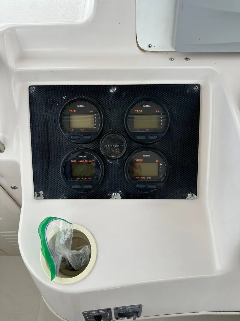 Slide: The Image of Control panel of 2001 Grady-White Sailfish 282 boat with four gauges. - 21