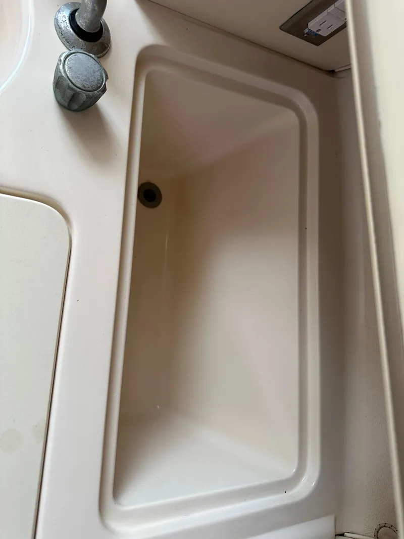 Slide: The Image of 2001 Grady-White Sailfish 282 boat sink with faucet detail. - 29