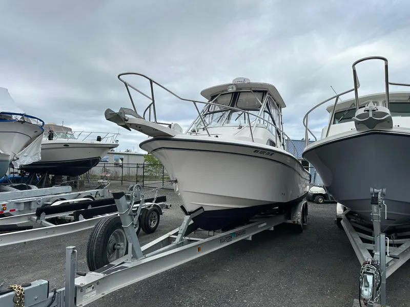 Slide: The Image of 2001 Grady-White Sailfish 282 boat on trailer, parked in a marina. - 3