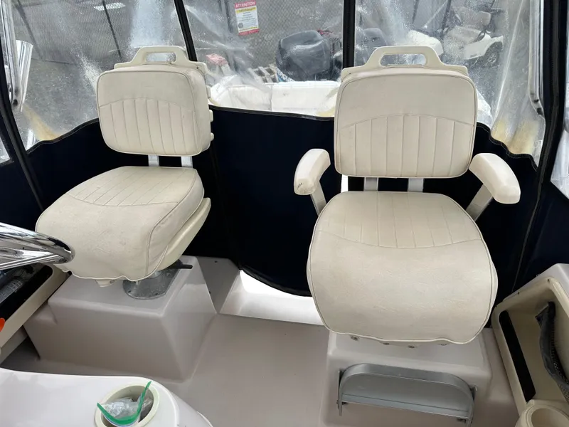 Slide: The Image of 2001 Grady-White Sailfish 282 boat interior with two white captain's chairs. - 32