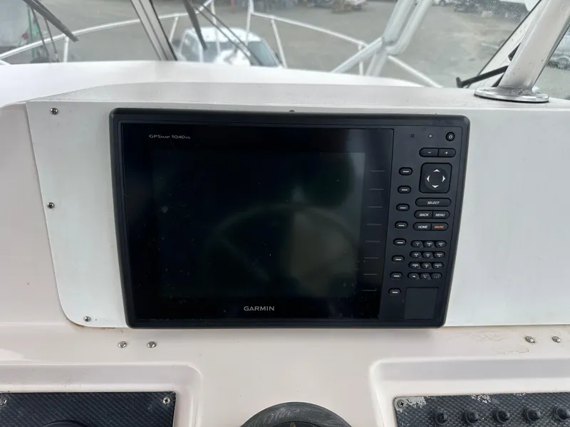 Slide: The Image of Garmin GPS display on 2001 Grady-White Sailfish 282 boat dashboard. - 34