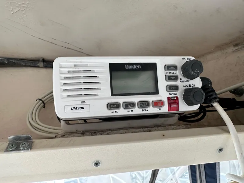 Slide: The Image of Uniden UM380 radio on 2001 Grady-White Sailfish 282 boat dashboard. - 35