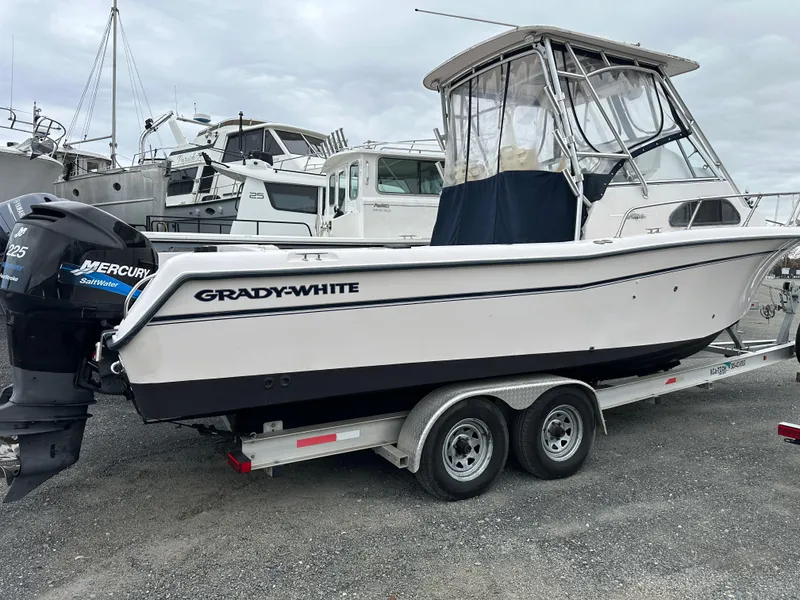 Slide: The Image of 2001 Grady-White Sailfish 282 boat on trailer, featuring Mercury outboard engine. - 4