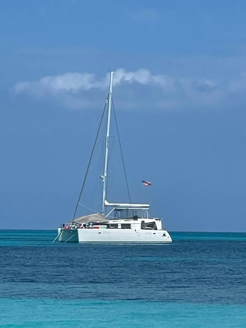 Slide: The Image of 2016 Lagoon 450 F catamaran sailing on clear blue ocean waters. - 1
