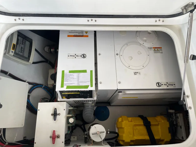 Slide: The Image of Engine compartment of a 2016 Lagoon 450 F catamaran, featuring mechanical and electrical components. - 18