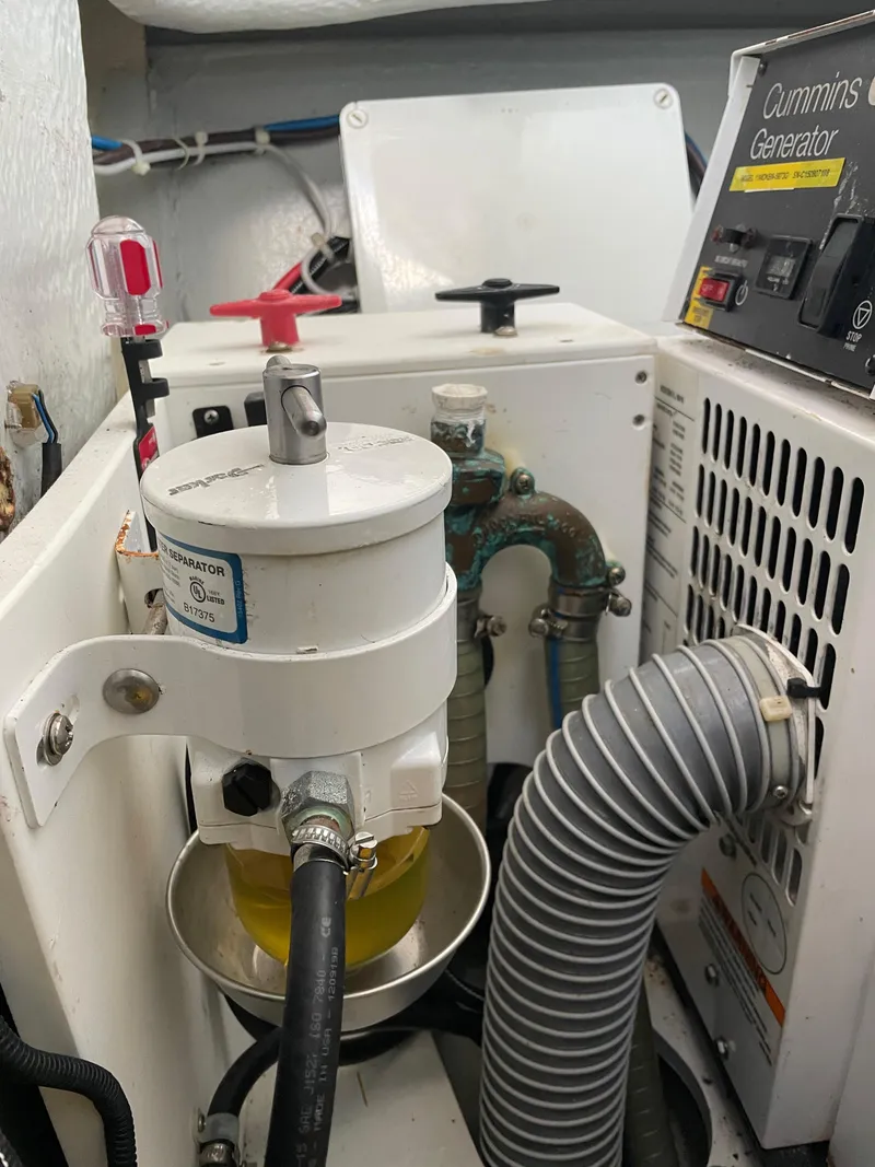 Slide: The Image of Engine room of a 2016 Lagoon 450 F with Cummins generator and fuel filter system. - 20
