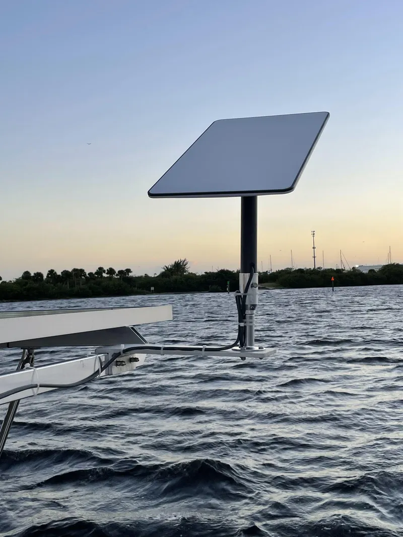 Slide: The Image of Satellite dish on Lagoon 450 F catamaran, 2016 model, at sunset over water. - 36