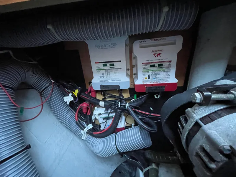 Slide: The Image of Electrical system components in a 2016 Lagoon 450 F yacht, featuring wiring and control panels. - 48