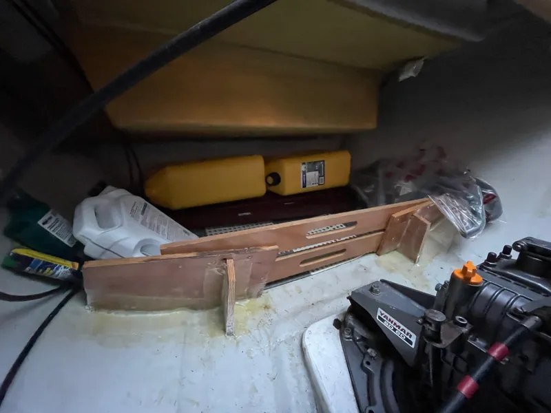 Slide: The Image of Storage compartment in a 2016 Lagoon 450 F yacht with various maintenance supplies. - 49