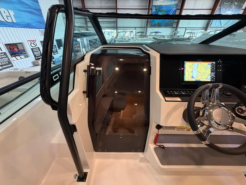 Slide: The Image of The image shows the cockpit of a 2026 Saxdor 320 GTO with a modern helm station. - 44