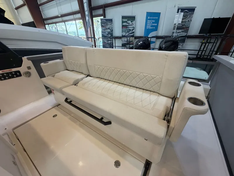 Slide: The Image of Interior of the Saxdor 320 GTO with cream-colored upholstery and cup holders. - 24