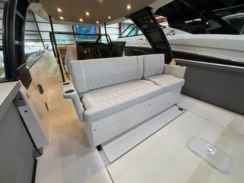 Slide: The Image of The image shows the interior of a Saxdor 320 GTO with sleek white upholstery and modern details. - 38
