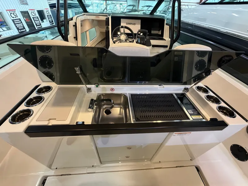 Slide: The Image of The 2026 Saxdor 320 GTO features a modern outdoor kitchen with a sink and grill. - 47