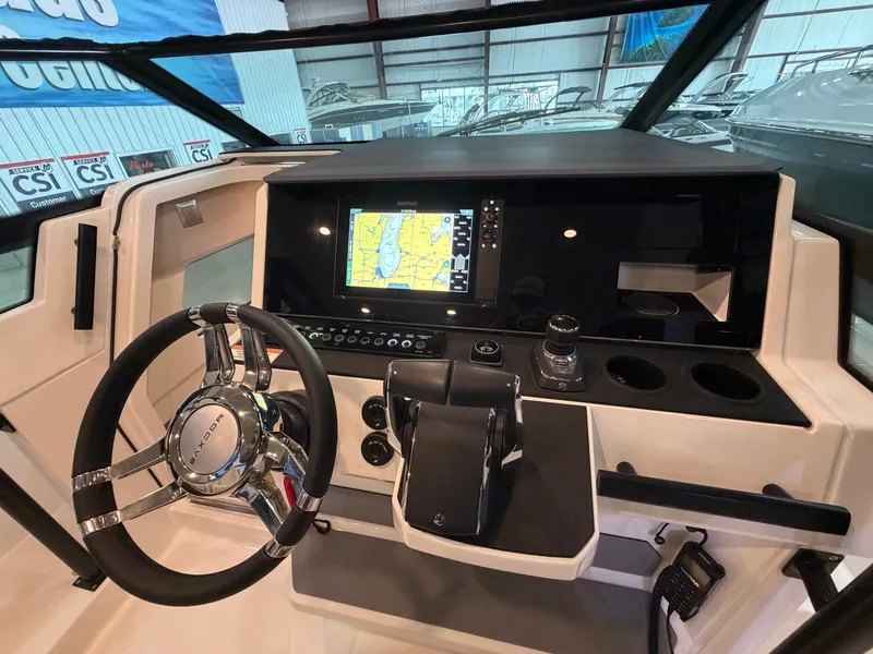 Slide: The Image of The 2026 Saxdor 320 GTO cockpit features a modern steering wheel and navigation system. - 22