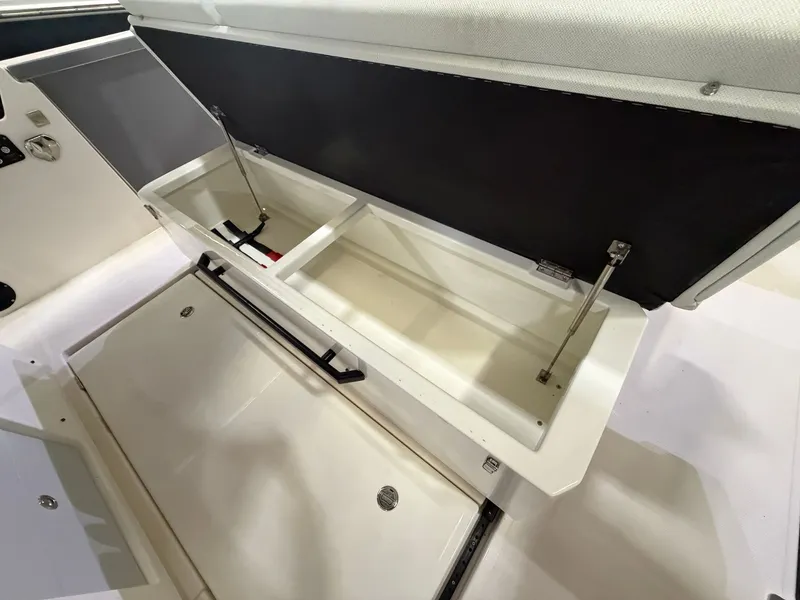 Slide: The Image of An open storage compartment on a Saxdor 320 GTO boat, showing spacious compartments. - 23