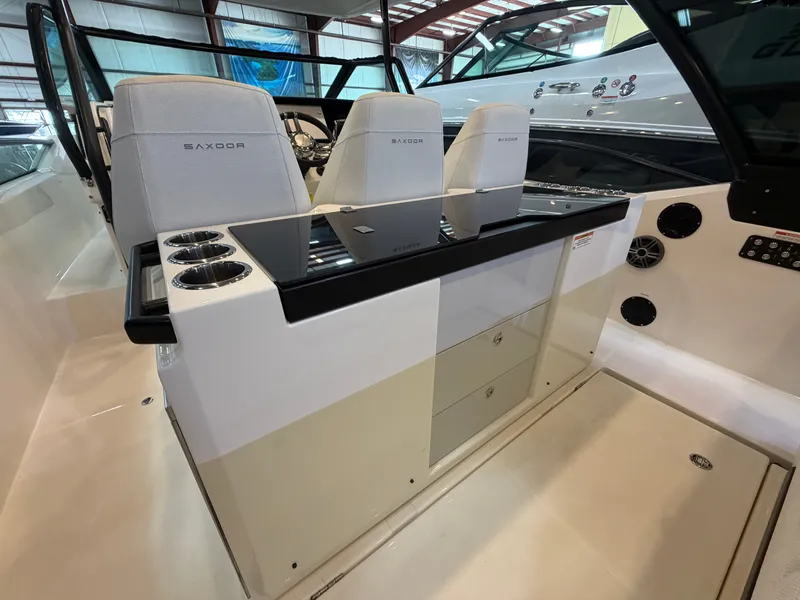 Slide: The Image of The image shows the cockpit of a Saxdor 320 GTO with modern seating and controls. - 34