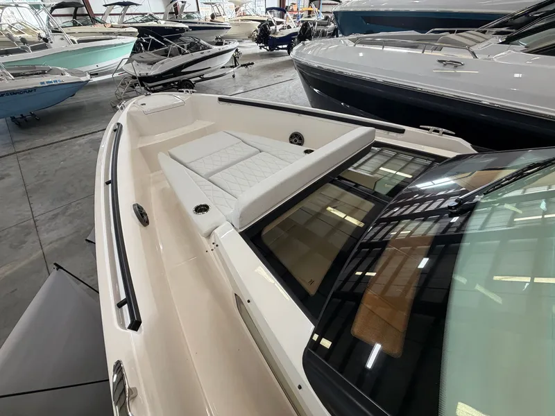 Slide: The Image of The image shows the foredeck of a Saxdor 320 GTO with cushioned seating. - 42