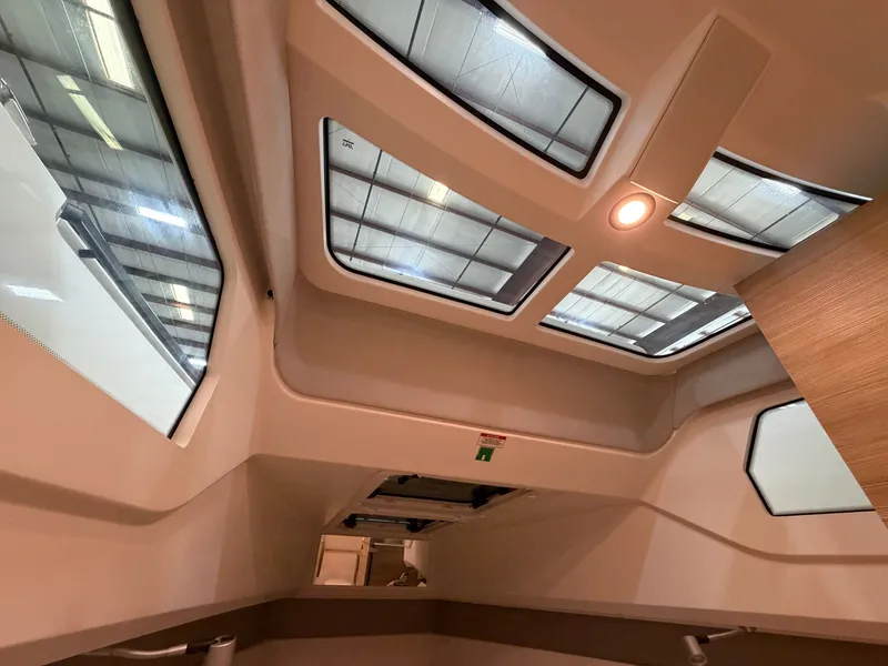 Slide: The Image of Interior view of a modern boat with large windows and wood paneling. - 45