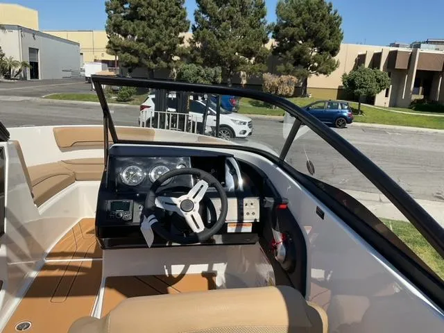 Slide: The Image of 2025 Bayliner V20i boat interior with modern dashboard and steering wheel. - 16