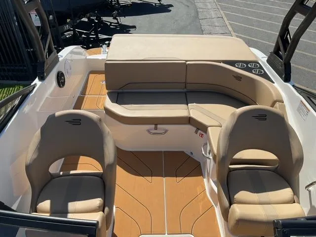 Slide: The Image of 2025 Bayliner V20i boat interior with beige seating and modern design. - 17