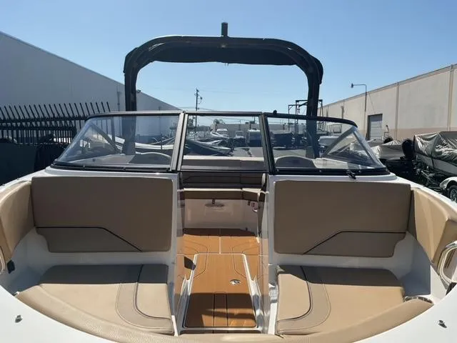 Slide: The Image of 2025 Bayliner V20i boat interior with tan seating and sleek design. - 21