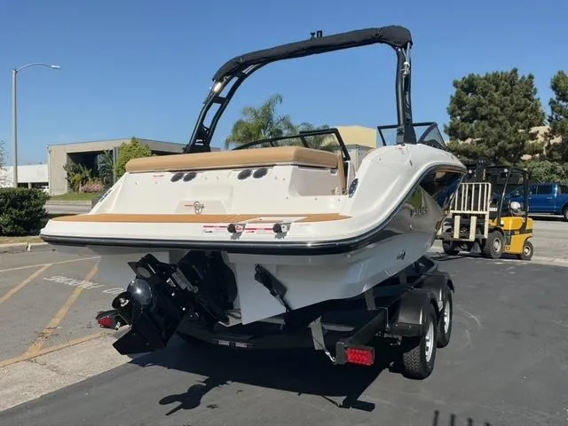 Slide: The Image of 2025 Bayliner V20i boat on trailer, outdoor setting, sunny day. - 5