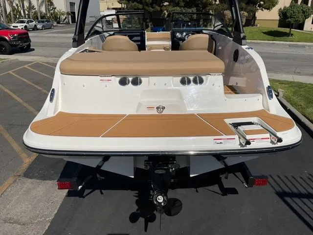 Slide: The Image of 2025 Bayliner V20i boat, rear view, showcasing swim platform and seating area. - 9