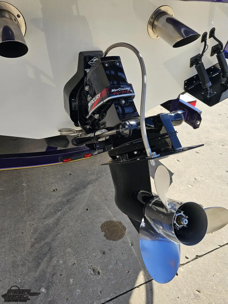 Slide: The Image of 2004 Baja 25 Outlaw boat with MerCruiser outdrive and dual exhaust. - 31