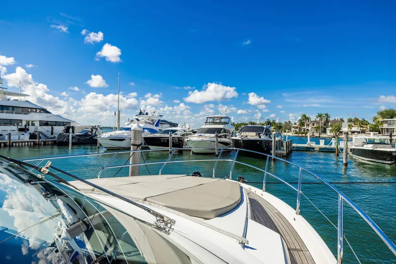 Slide: The Image of Luxurious Absolute 52 FLY yacht docked in a sunny marina, 2018 model. - 19