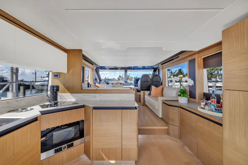 Slide: The Image of Luxurious interior of 2018 Absolute 52 FLY yacht with modern kitchen and seating area. - 22