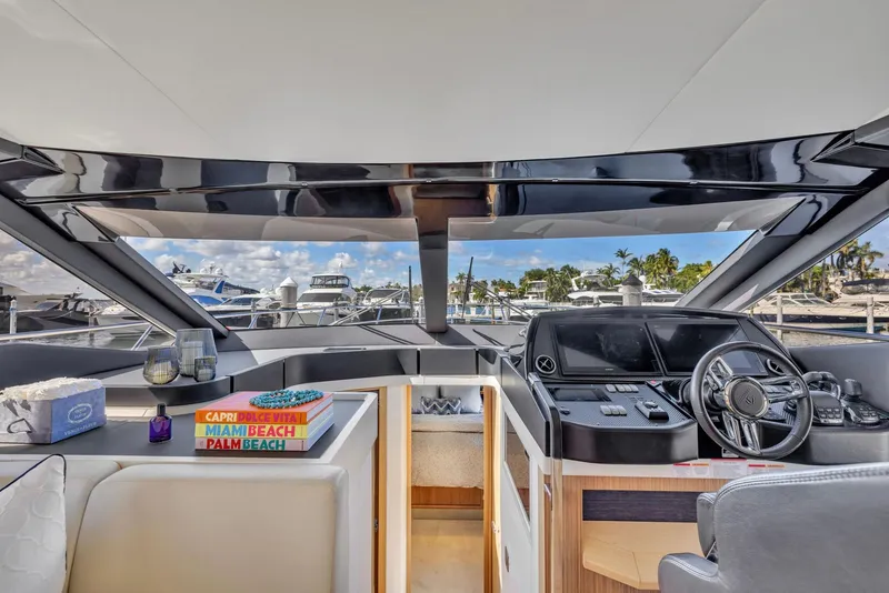 Slide: The Image of Luxurious interior of 2018 Absolute 52 FLY yacht with modern helm and scenic marina view. - 24