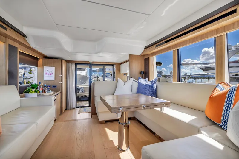 Slide: The Image of Luxurious interior of 2018 Absolute 52 FLY yacht with elegant seating and panoramic windows. - 25