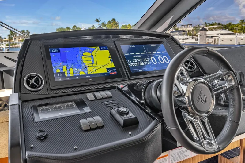 Slide: The Image of Cockpit of 2018 Absolute 52 FLY yacht with navigation screens and steering wheel. - 26