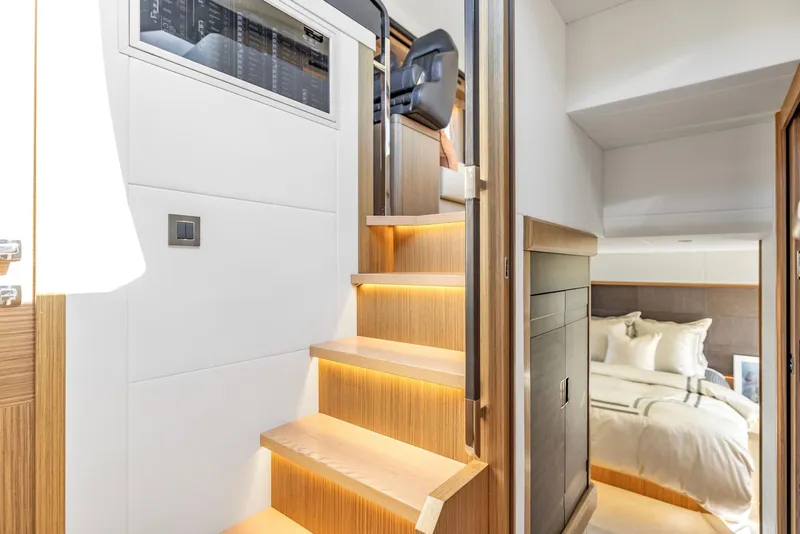 Slide: The Image of Interior of 2018 Absolute 52 FLY yacht with wooden stairs and cozy bedroom. - 27