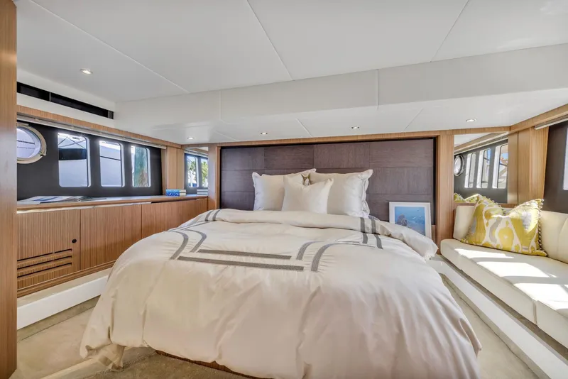 Slide: The Image of Luxurious bedroom interior on a 2018 Absolute 52 FLY yacht, featuring elegant bedding and modern design. - 28