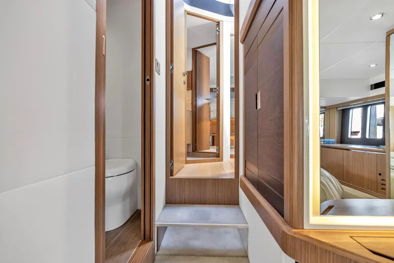 Slide: The Image of Interior of 2018 Absolute 52 FLY yacht, featuring modern wood finishes and sleek design. - 31