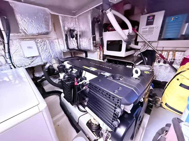 Slide: The Image of Engine room of a 2018 Absolute 52 FLY yacht, showcasing machinery and equipment. - 36