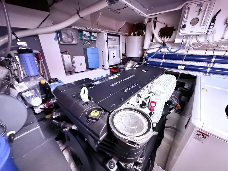 Slide: The Image of Engine room of a 2018 Absolute 52 FLY yacht, featuring a Volvo Penta IPS 600 engine. - 37