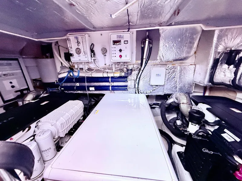 Slide: The Image of Engine room of a 2018 Absolute 52 FLY yacht, featuring advanced mechanical systems. - 38
