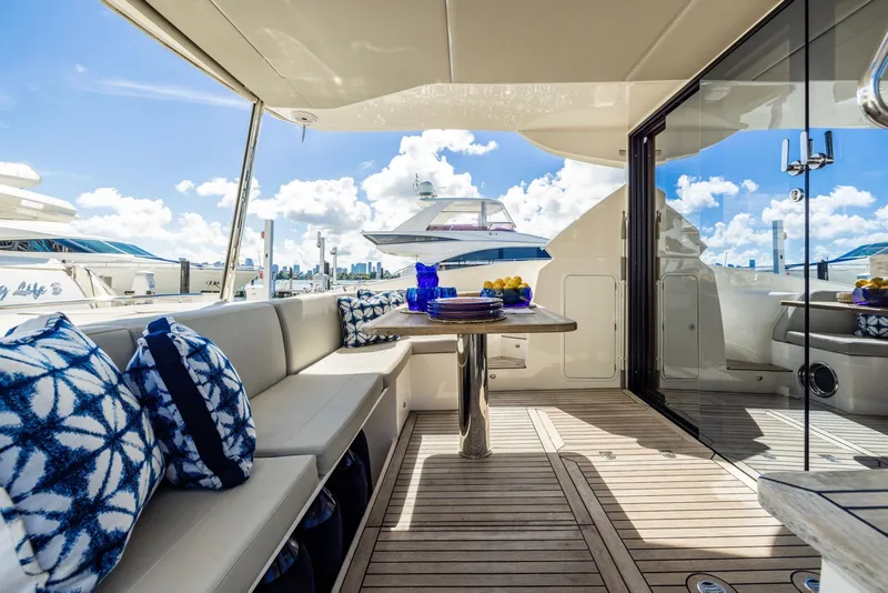 Slide: The Image of Luxurious 2018 Absolute 52 FLY yacht deck with elegant seating and scenic ocean view. - 9
