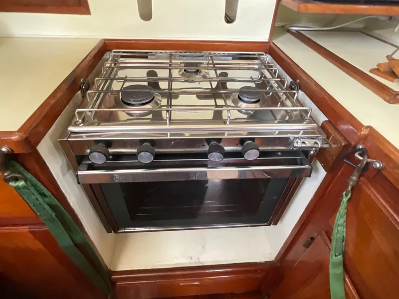 Slide: The Image of Stainless steel stove and oven in 1984 Clearwater Cutter boat kitchen. - 10