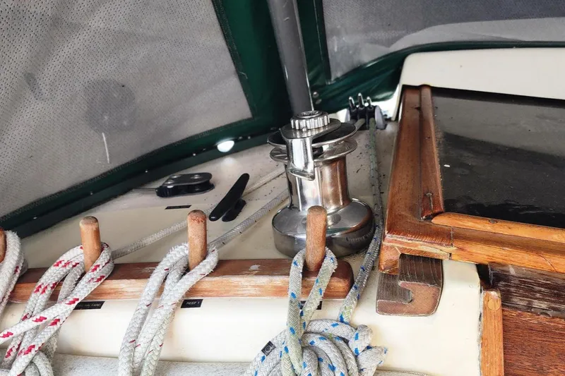 Slide: The Image of 1984 Clearwater Cutter sailboat deck with ropes and winch. - 20