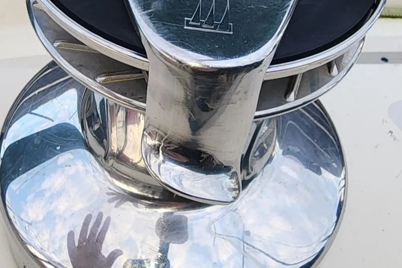 Slide: The Image of Close-up of a shiny metal winch on a 1984 Clearwater Cutter sailboat. - 21