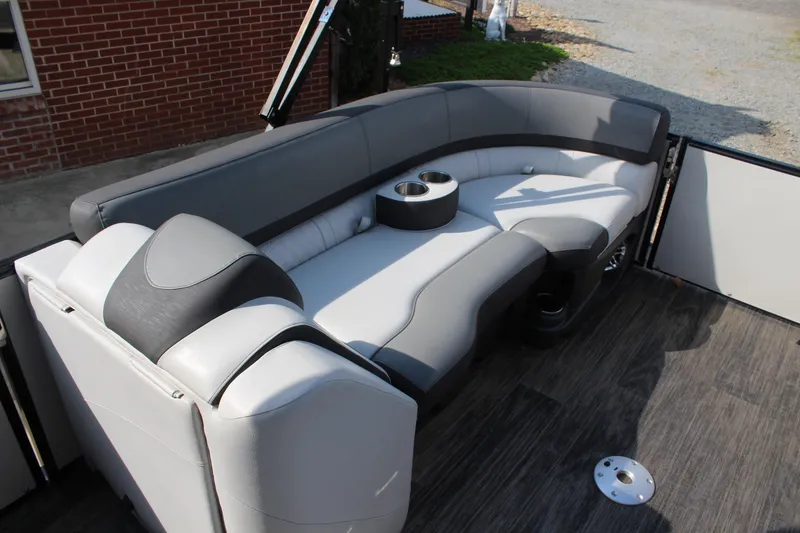 Slide: The Image of 2023 Tahoe Pontoon Cascade Platinum Versatile Rear Bench with sleek gray seating and cup holder. - 11