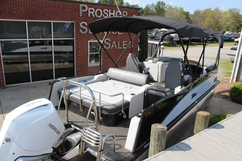 Slide: The Image of 2023 Tahoe Pontoon Cascade Platinum Versatile Rear Bench 23' at dealership dock. - 4