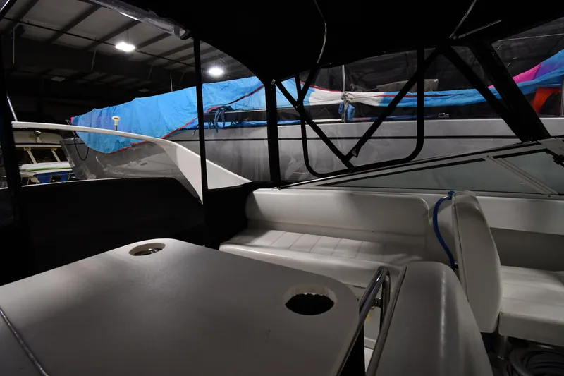 Slide: The Image of Interior of a 2000 Carver 350 Mariner yacht in a dimly lit storage area. - 14