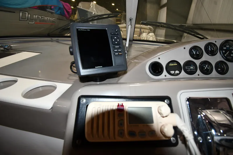 Slide: The Image of Control panel of a 2000 Carver 350 Mariner boat with navigation equipment. - 17